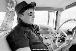 Profile of Danny Gatton in one of his old cars from 1990