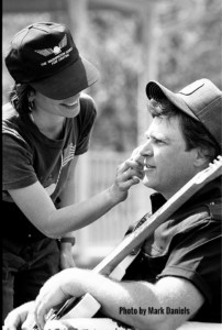 Virginia Quesada is putting on anti-shiny powder on Danny Gatton prior to his interview 4.24.90